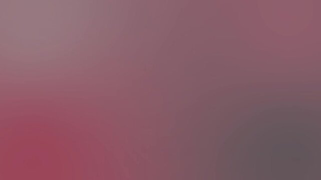 A close-up shot of a red and gray gradient background with a shallow depth of field, conveying a moody and dramatic atmosphere.
