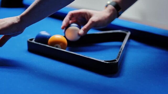 Elegant Hand With Ring Gently Arranges Colored Billiard Balls Before The Match