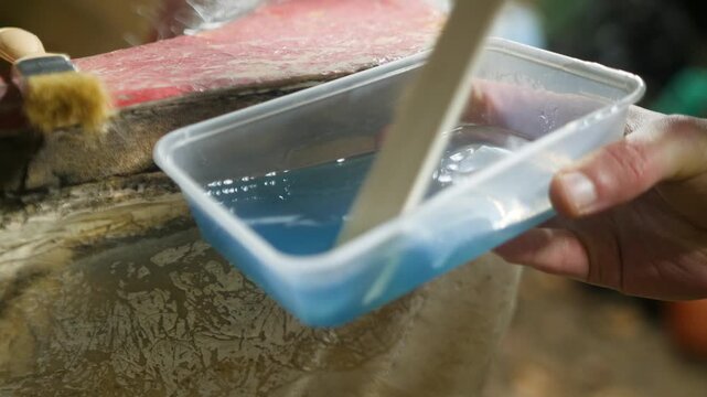Mixing polyester fiberglass resin in container