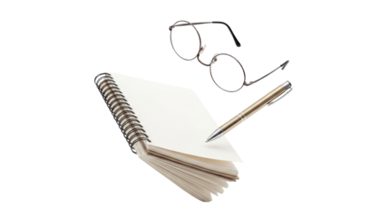 overhead view of a spiral-bound notebook, pen, and round eyeglasses on a dark background, suggesting journaling or planning.