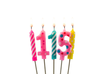 Five metallic birthday candles with colorful stripes and polka dots, vibrant flames, isolated on white background with copy space, shallow depth of field, bokeh. Birthday celebration atmosphere