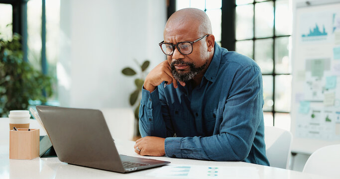 Thinking, financial advisor and black man in office, laptop and research for trading portfolio. Mature person, decision and investor with pc, solution and email for profit growth, confused and choice