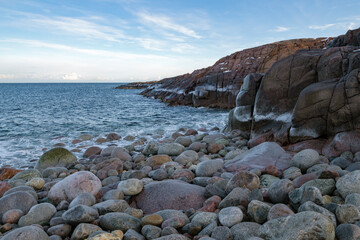 Rocks on the shore of the Barents Sea on a March day. Teriberka, Russia