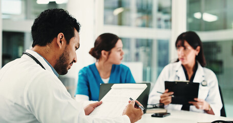 Fototapeta premium Meeting, clipboard and planning with doctors in hospital for team, surgery schedule and healthcare. Patient records, discussion and medical with people in clinic for checklist, research and review