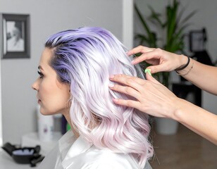 Fototapeta premium A woman's hair being styled with purple and pink dye