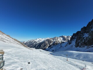 Snow covered mountain with a ski lift in the background