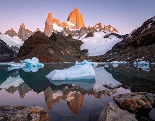 Stunning sunrise view of a mountain range reflected in a calm glacial lake