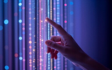 Hand gently touches glowing vertical light strands in vibrant, futuristic digital display.
