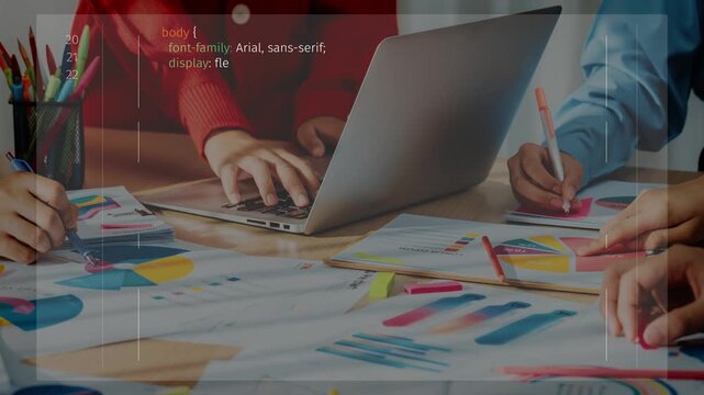 A group of diverse professionals collaborate on project planning using colorful charts and a modern laptop amidst a productive office setting. Ideal for business and teamwork concepts. Raster