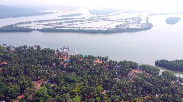 Aerial view of prawn farming ponds along the coastline, showcasing aquaculture and sustainable food production in Karnataka.