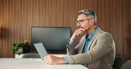 Thinking, man and employee with laptop, office and research for risk assessment on website or online. Business, financial analyst and mature person with tech for budget review, reading and decision