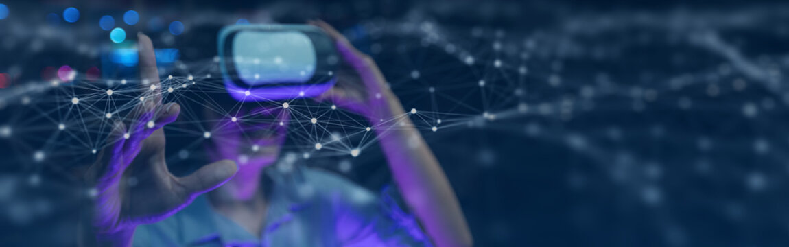 Woman wearing VR headset experiencing virtual reality metaverse network technology - Powered by Adobe