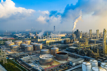 Aerial view of an oil refinery and chemical plant with smoking chimneys in industrial area