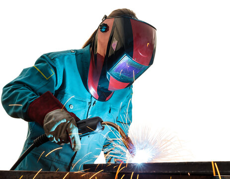 Welder in red and black helmet, teal protective jacket, and thick red gloves, actively performing arc welding on, isolated on transparent background
