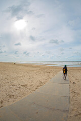 Woman by the sea in winter.
