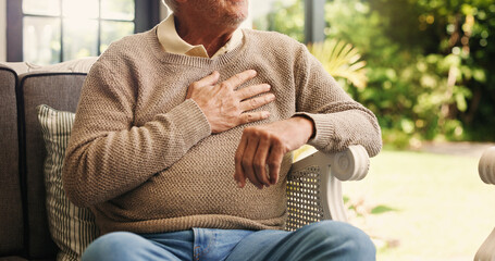 Hands, senior man and chest pain at house from cardiac attack, heart failure and hypertension....
