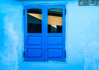 Blue windows in an old house in Phan Rang, Vietnam