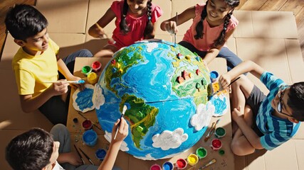 Children painting a globe - Powered by Adobe