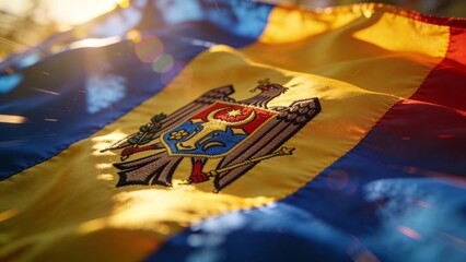Detailed view of the Moldovan flag waving in sunlight, showcasing the coat of arms. Great for educational materials or decorative uses.