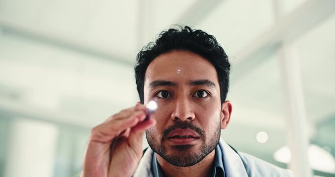 Penlight, brain exam and doctor in clinic for consultation with eye check for medical response. Man, movement and male healthcare worker with tool for nerve function with assessment in hospital.