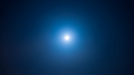 Obraz premium Vibrant blue light shining bright in dark space