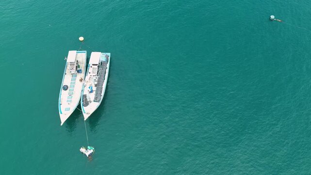 4K Aerial View of Traditional Fishing Village and Colorful Boats at Sendang Biru, Malang
