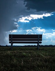 Lone bench under a dramatic sky