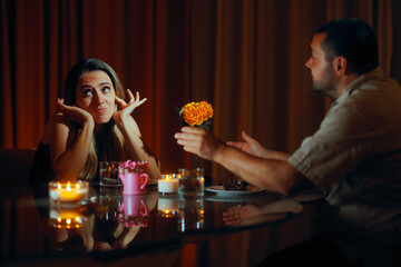 Woman on a Date Covering her Ears because of a Boring Partner. Annoyed girlfriend can not put up with her talkative boyfriend