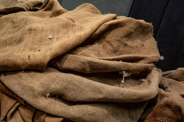 Brown burlap fabric texture with woven material and fibers