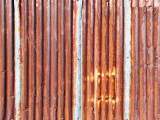 Old zinc surface background or the tin roof background with the rust