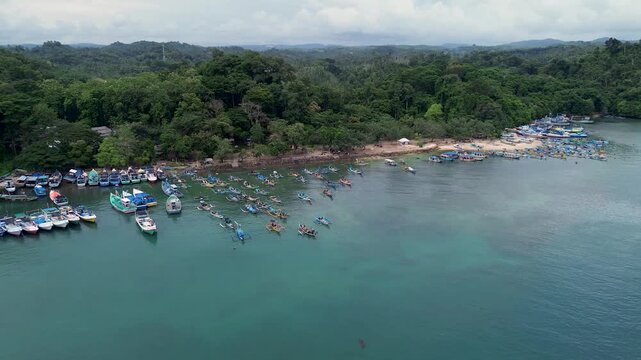 4K Aerial View of Traditional Fishing Village and Colorful Boats at Sendang Biru, Malang
