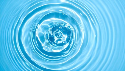 Close-up shot of a tranquil water surface with concentric ripples, reflecting soft light in bright blue hues