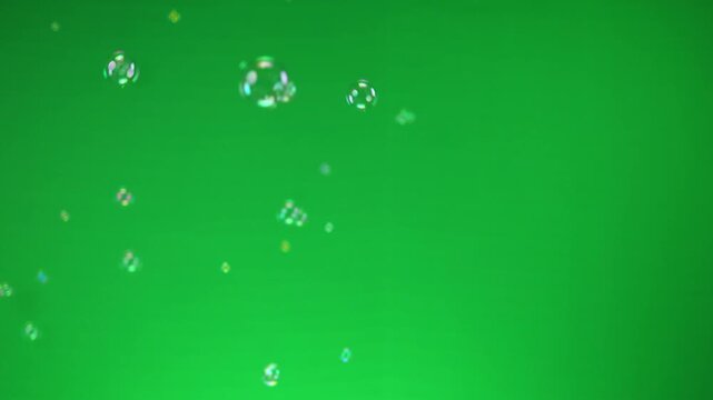soap bubbles, flying soap bubbles, floating soap bubbles on chroma key green screen background, 4k video for happy and funny playful concept