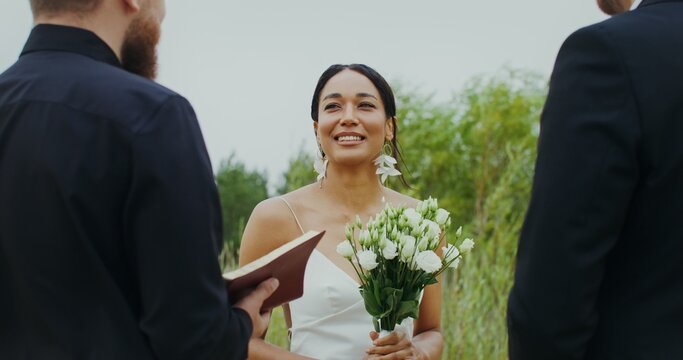 Outdoor wedding, close-up of a smiling bride