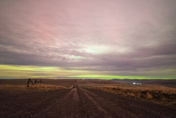 Long Road Through Hills With Northern Lights