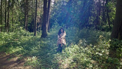Obraz premium Top view, young woman posing sitting on a chair in the forest