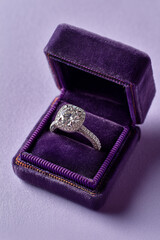 Luxury Diamond Engagement Ring in Purple Velvet Box on Lavender Background
