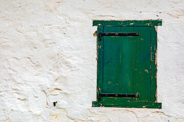 detailed view of green historic colonial building shutter window
