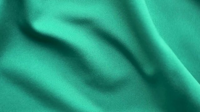 Green sports clothing fabric football shirt jersey texture close up