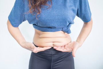 Fat woman holding her belly on white background. Diet and weight loss concept.