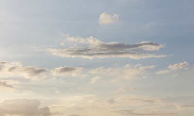 A clear blue sky with a few clouds