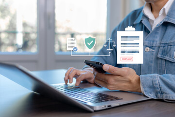 Business compliance and regulatory verification concept. Professional working on laptop and smartphone with digital compliance icons, document approval, legal protection, and governance system.