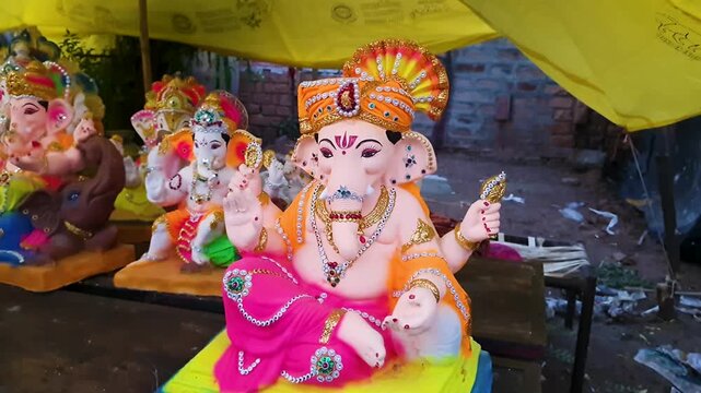 artistic lord ganesha idols arranged in row at local vendor stall