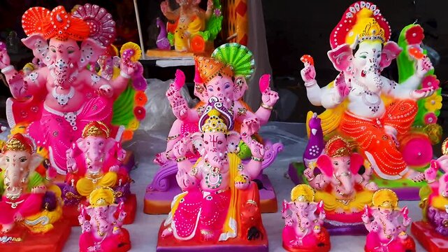 handcrafted ganesh idols showcased at street market for festival buyers