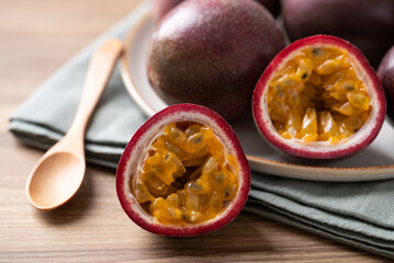 Fresh passion fruit and wooden spoon ready to eating, Tropical fruit