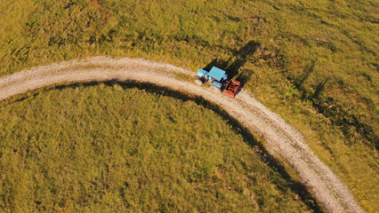 Tranquil sunny summer landscape with green fields and hills.