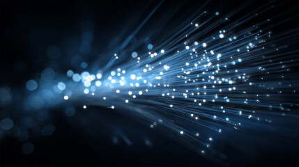 Abstract blue fiber optic cables with glowing light ends representing high-speed data transmission, global connectivity, and advanced telecommunication technology in a dark setting