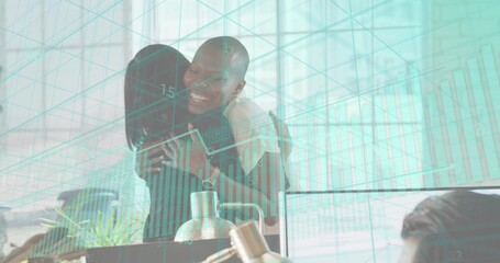 Hugging two coworkers wearing business attire at office desk with monitors and teal data overlay