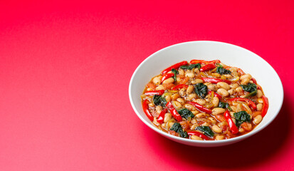 Vegetable stew with beans, spinach, peppers, tomatoes, and onions. Healthy eating. Vegetarian food.