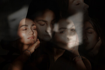 A woman with black hair wakes up in the morning in a white blanket and catches the rays of the sun. The portrait is creative, with brown eyes. High quality photo